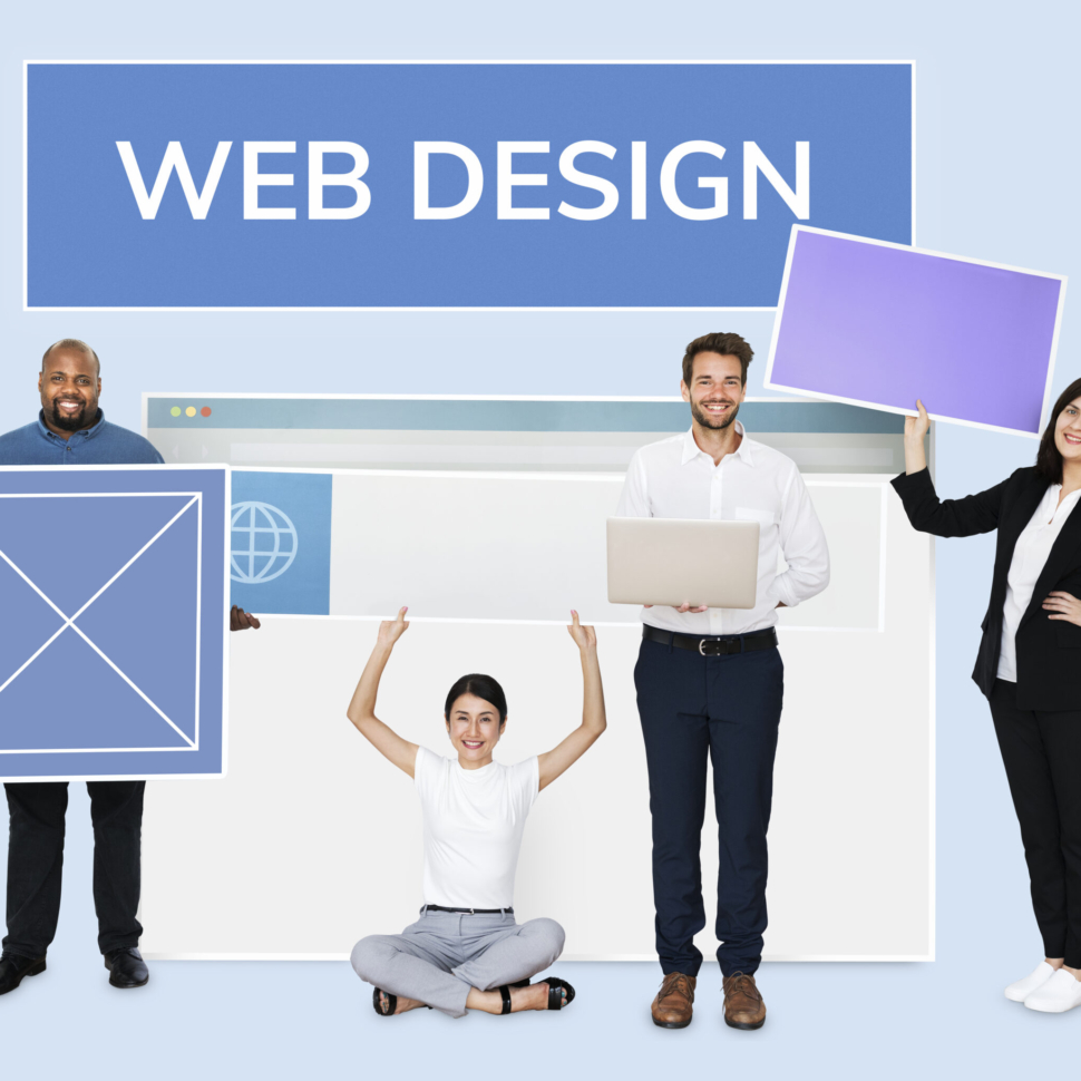 Happy diverse people holding a wed design board